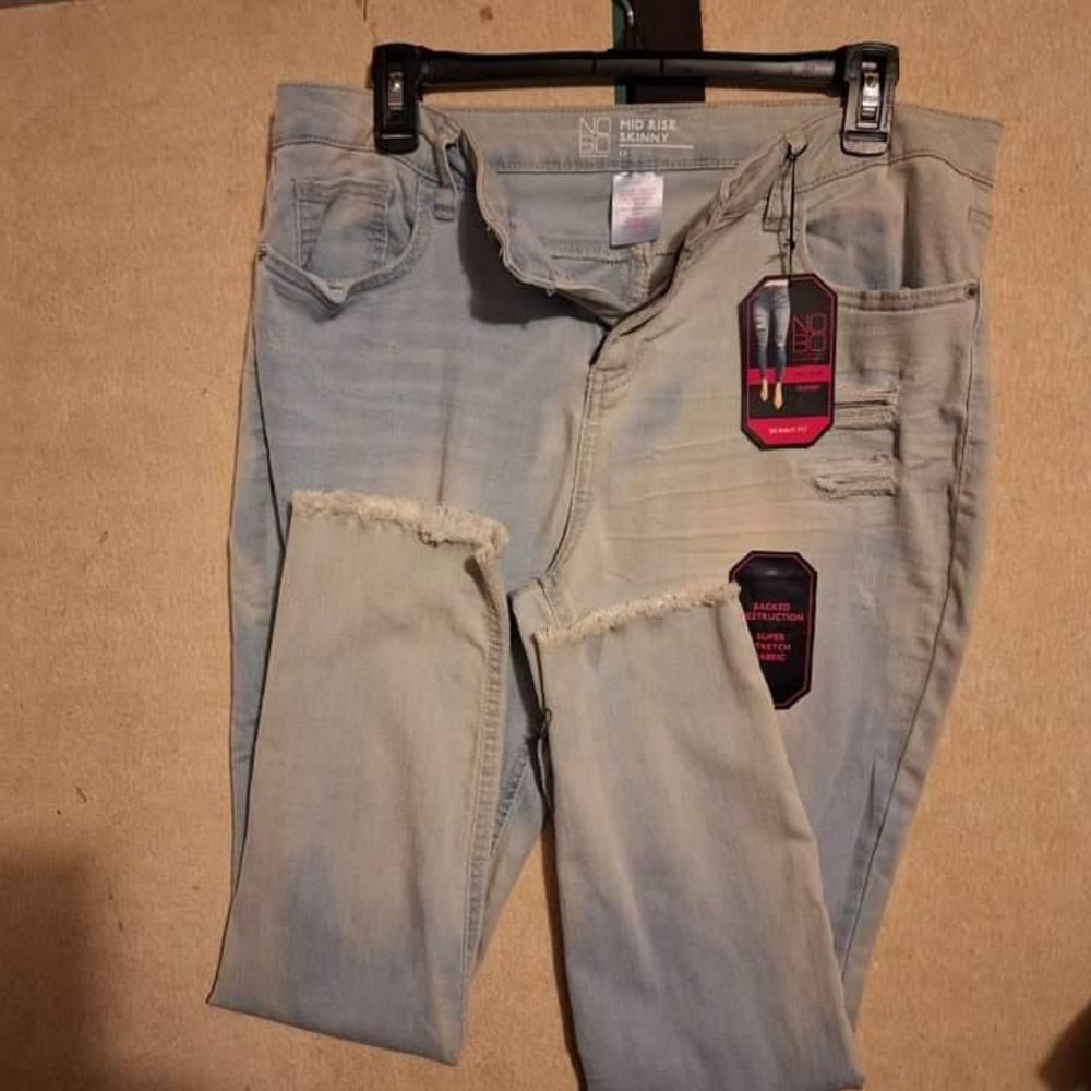 No Boundaries, mid rise light blue skinny jeans.